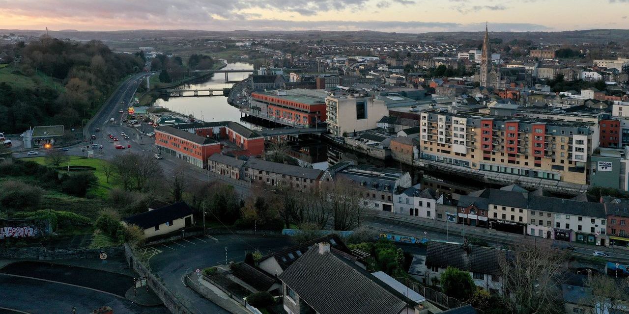 Aerial view of Drogheda spanning the River Boyne, with the town's church spire and bridges visible